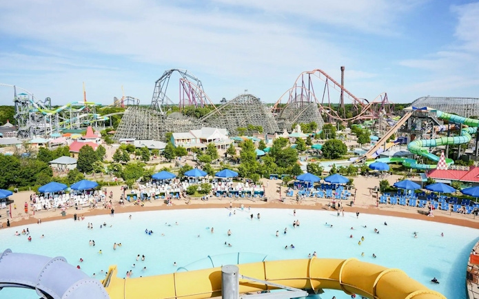 Water park with wave pool and slides at Hurricane Harbor Chicago.