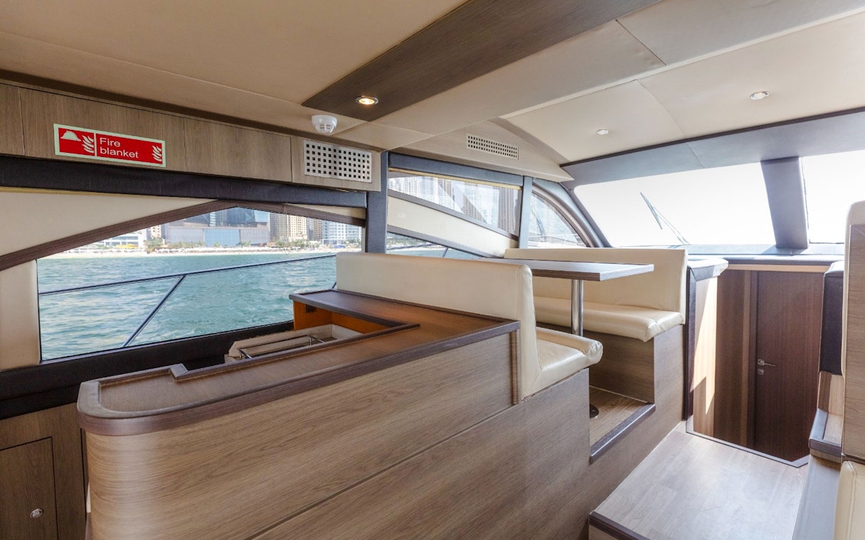 Interior seating area of Viktoriia Luxury Yacht with ocean view.