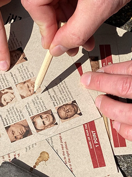 Participants solving clues for Murder Mystery Experience at Round Tower, Copenhagen.