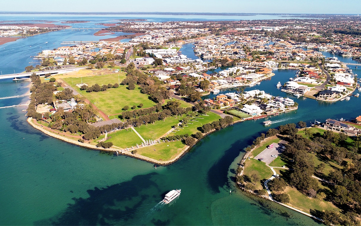 Aerial view of Mandurah's waterways and residential areas in Western Australia.