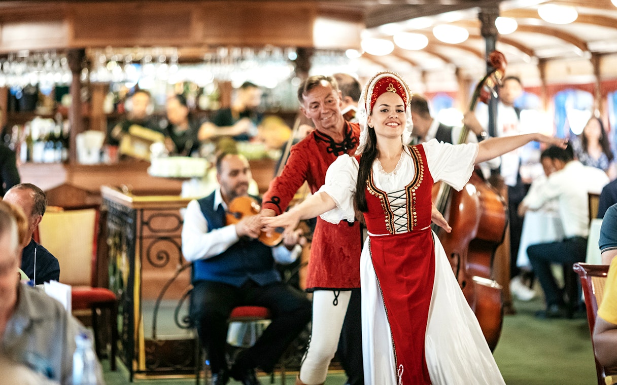 Guests enjoying traditional dance performance on New Year’s Eve Cruise in Budapest.