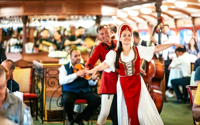 Guests enjoying traditional dance performance on New Year’s Eve Cruise in Budapest.