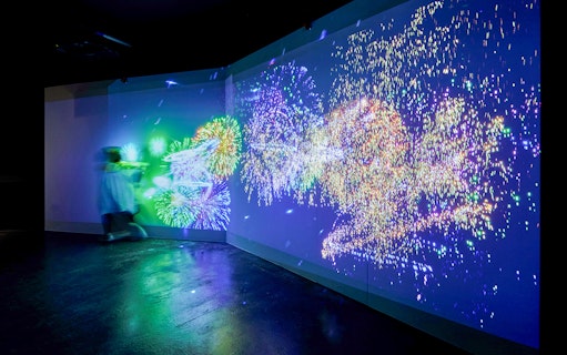 Fireworks display projected on a wall at Kobe Port Tower exhibit.