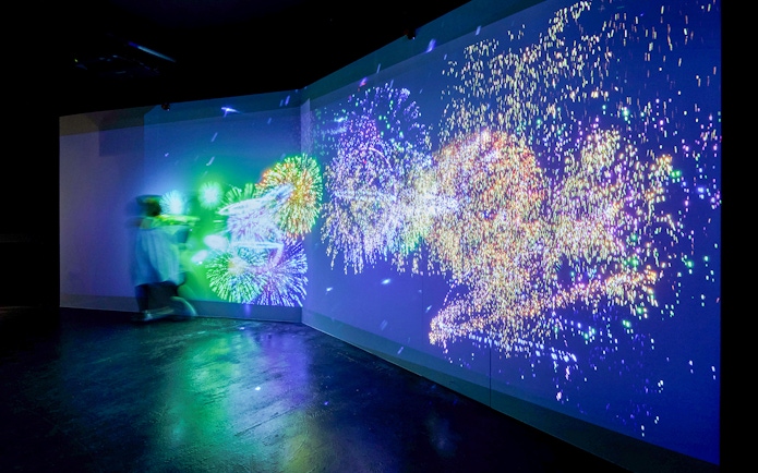 Fireworks display projected on a wall at Kobe Port Tower exhibit.