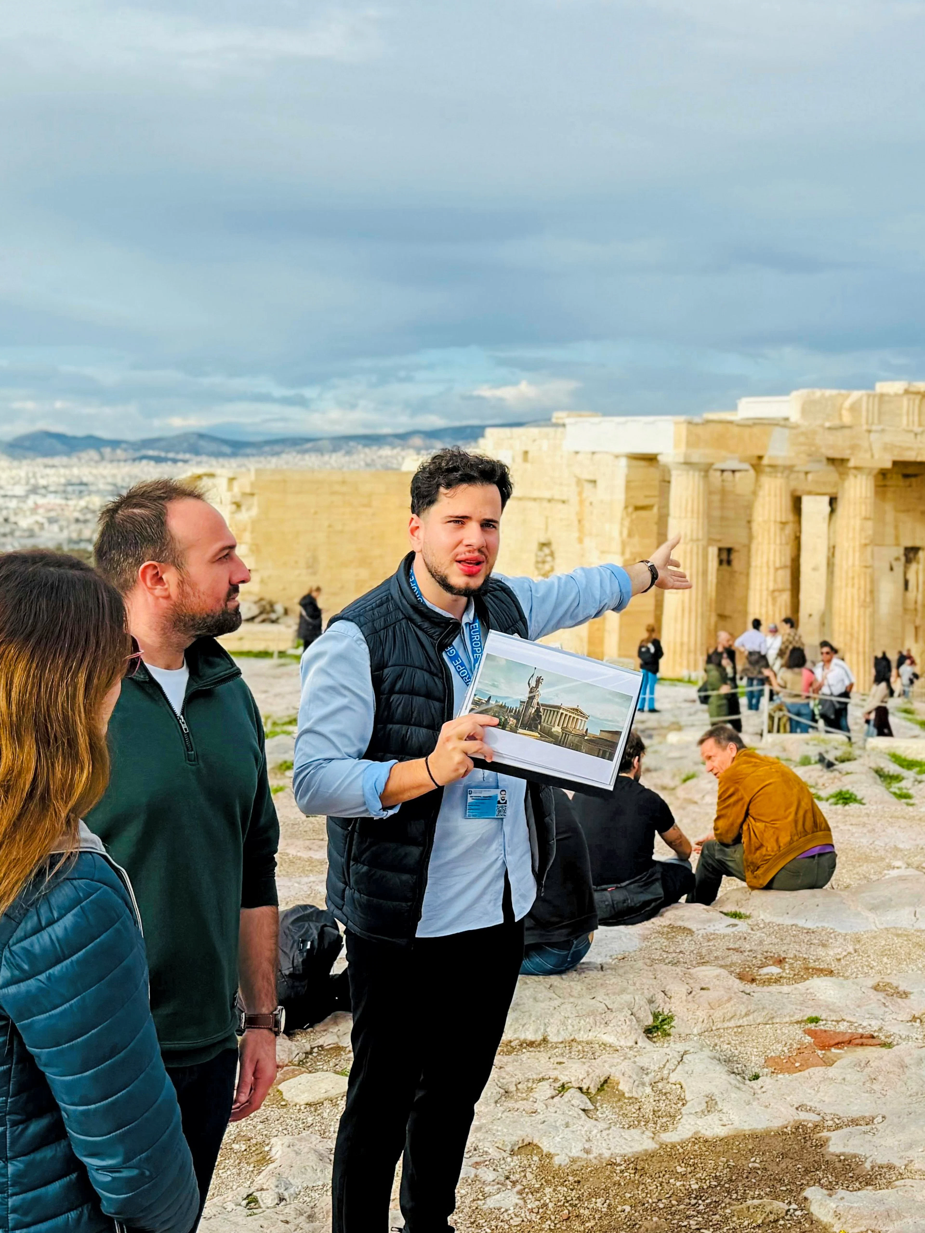 Small group tour at the Parthenon, guide explaining Acropolis history in Athens.