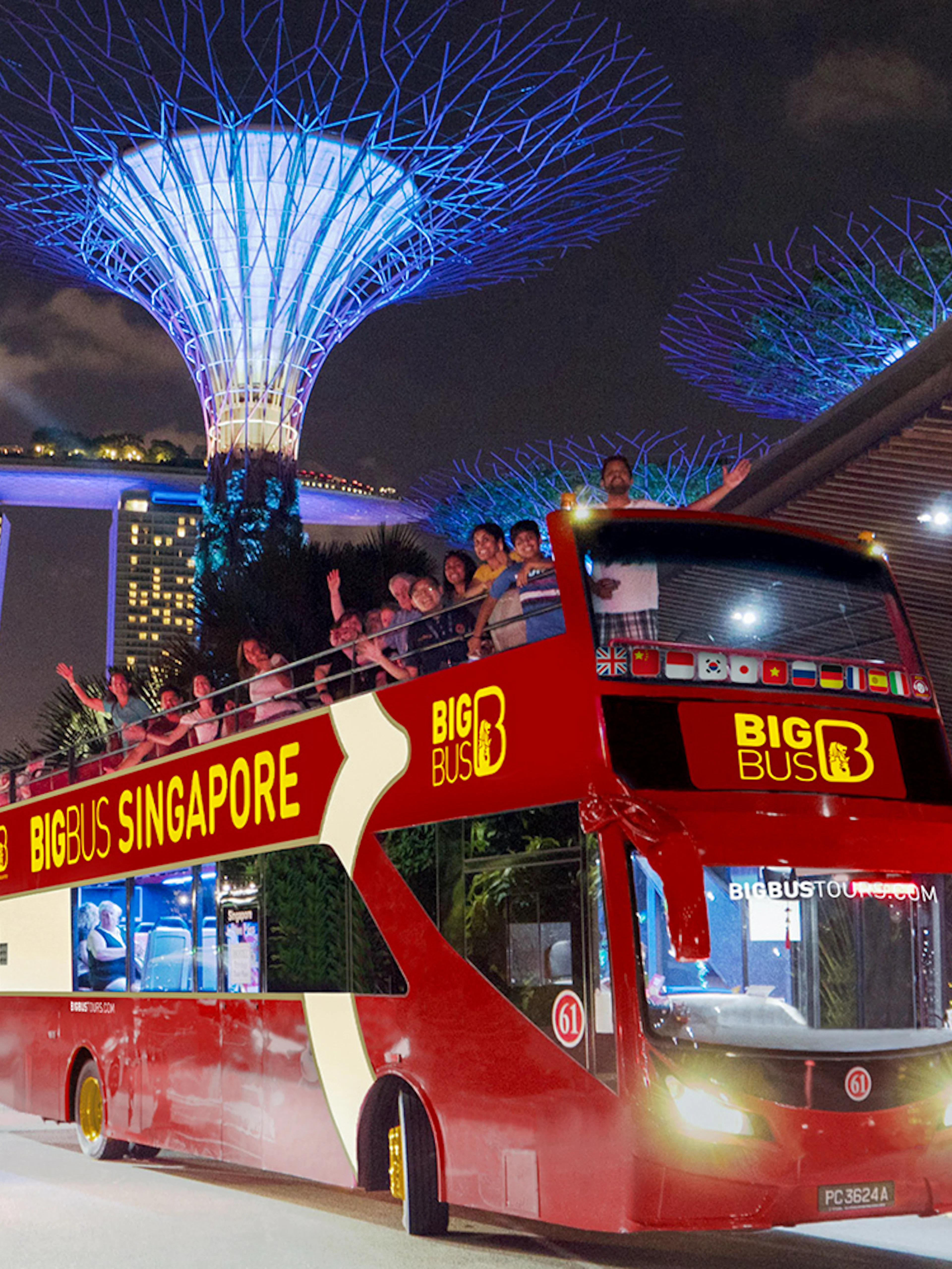 Open-top bus on Singapore Christmas light tour near Marina Bay Sands.