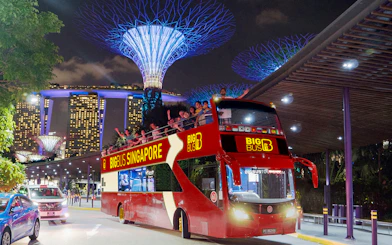 Open-top bus on Singapore Christmas light tour near Marina Bay Sands.