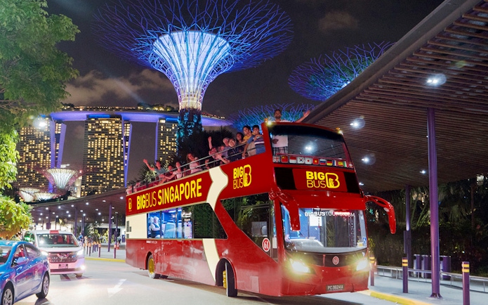Open-top bus on Singapore Christmas light tour near Marina Bay Sands.