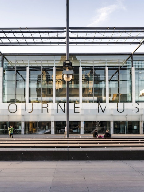 Melbourne Museum entrance with glass facade, located in Victoria.