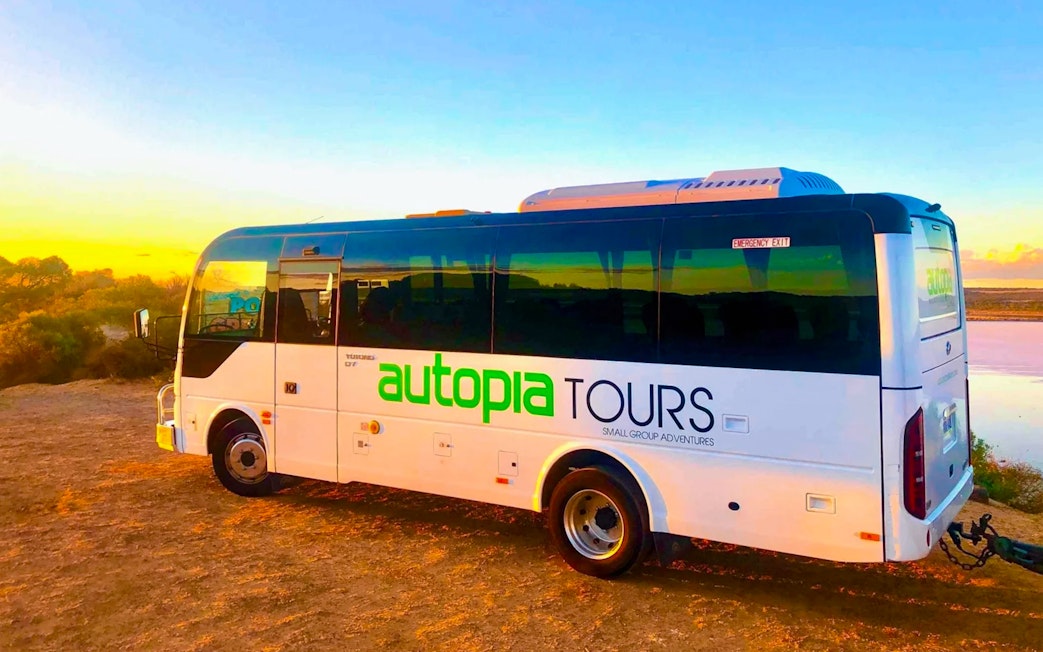 Transfer bus for Great Ocean Road Reverse Tour at sunset.