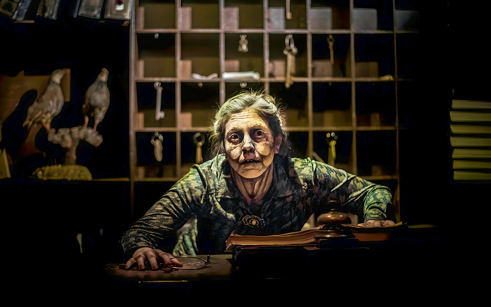 Receptionist in eerie setting at Hotel Krüeger, Tibidabo.