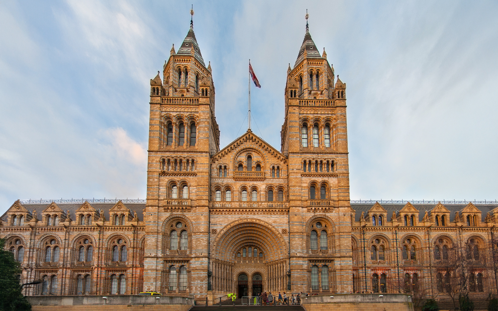 Natural History Museum London exterior with wildlife photography exhibition banner.