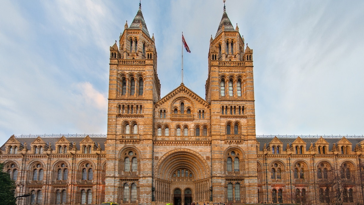Natural History Museum London exterior with wildlife photography exhibition banner.