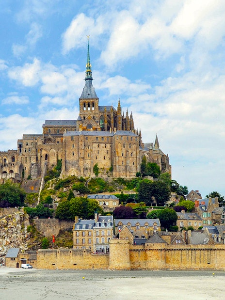 Mont Saint-Michel island with abbey and surrounding village, France.