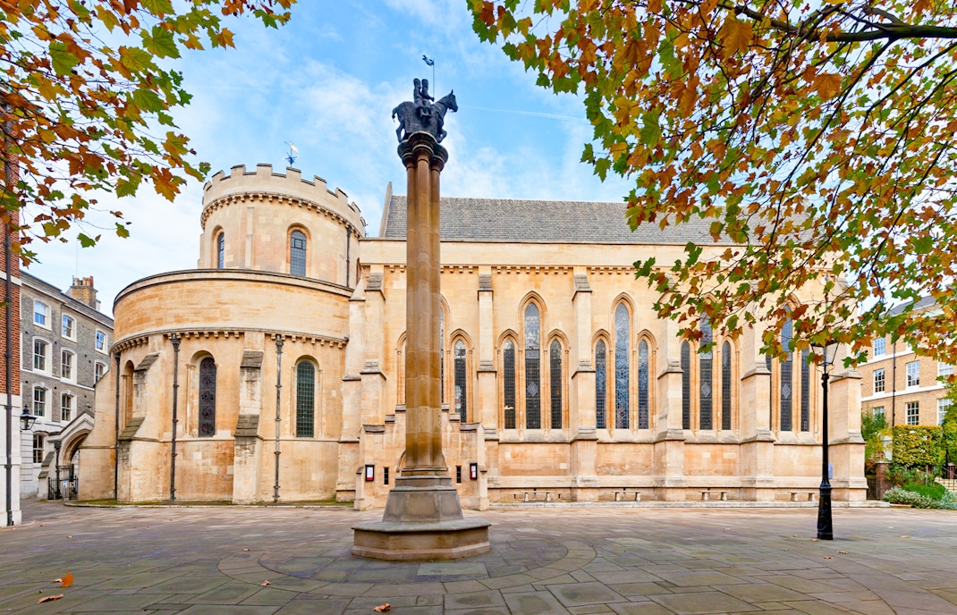 Temple Church in London with round nave and autumn leaves.
