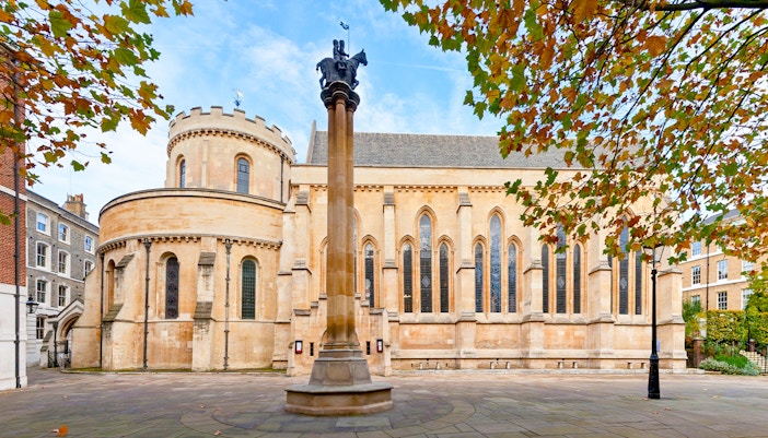 Temple Church in London with round nave and autumn leaves.