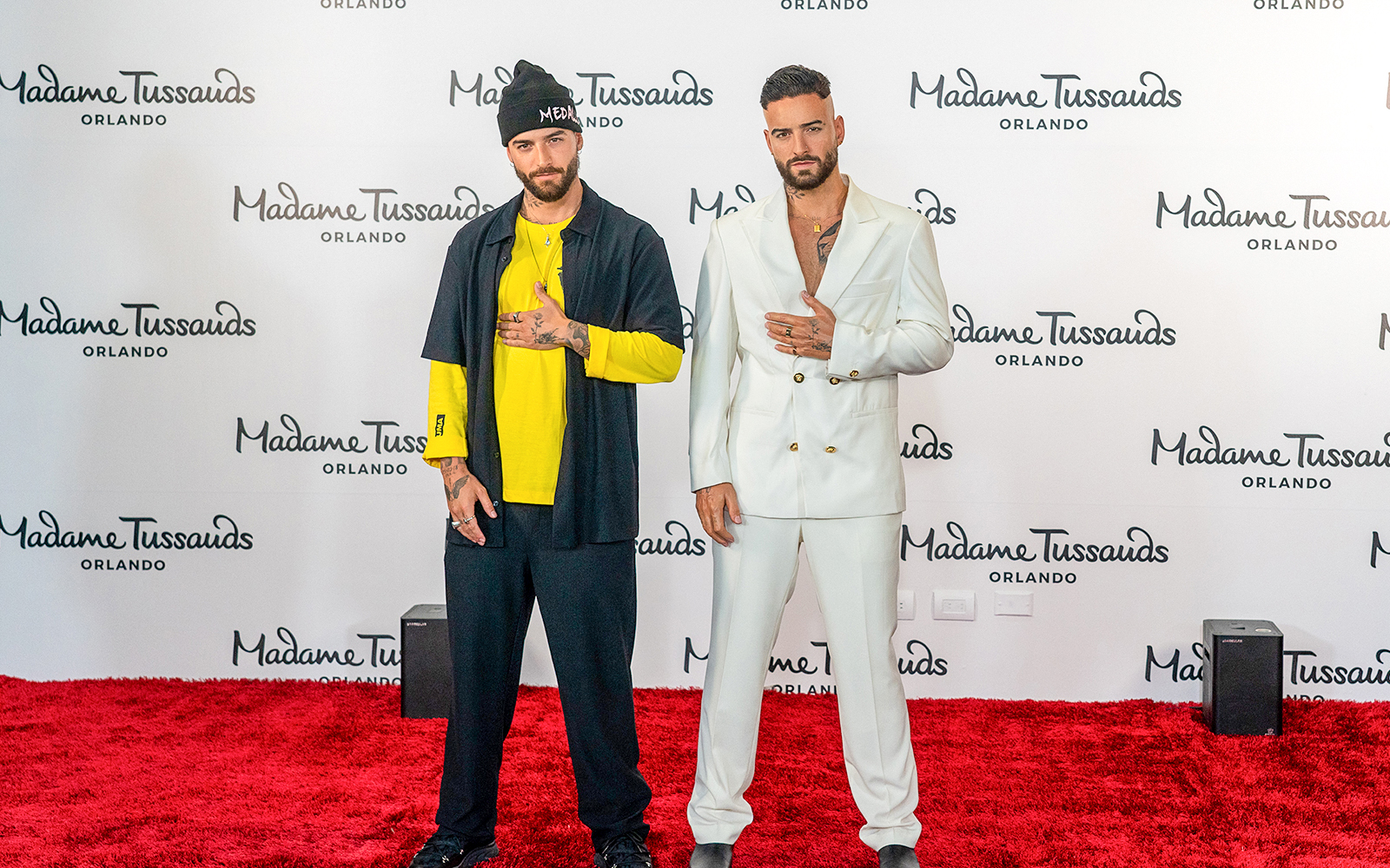 Maluma with his wax statue at Madame Tussauds Orlando reveal event.