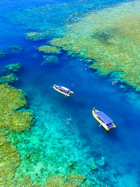 Aerial view of snorkelers near boats in the Whitsundays, Australia.