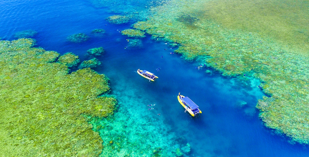 Whitsundays snorkel cruise boat near Hill Inlet, turquoise waters, Airlie Beach departure.