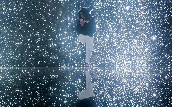 Tourist enjoying illuminated display at MIRACLEWORLD Osaka.