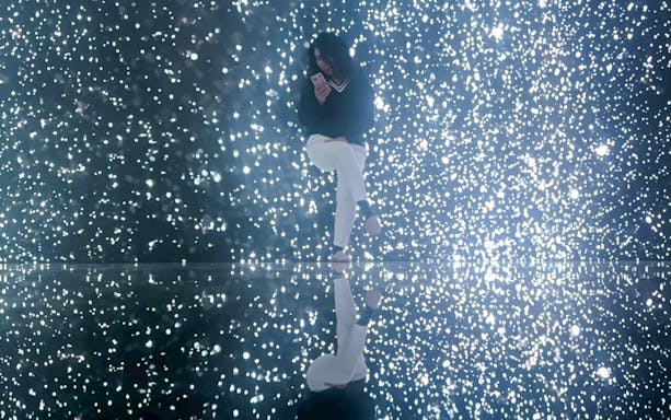Tourist enjoying illuminated display at MIRACLEWORLD Osaka.