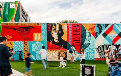 Wynwood Walls Museum visitors admire vibrant street art murals.