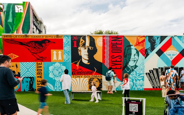 Wynwood Walls Museum visitors admire vibrant street art murals.