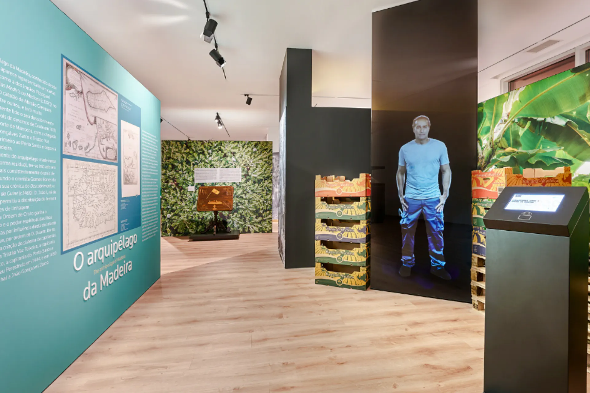 Madeira museum exhibit with historical maps and banana crates display.
