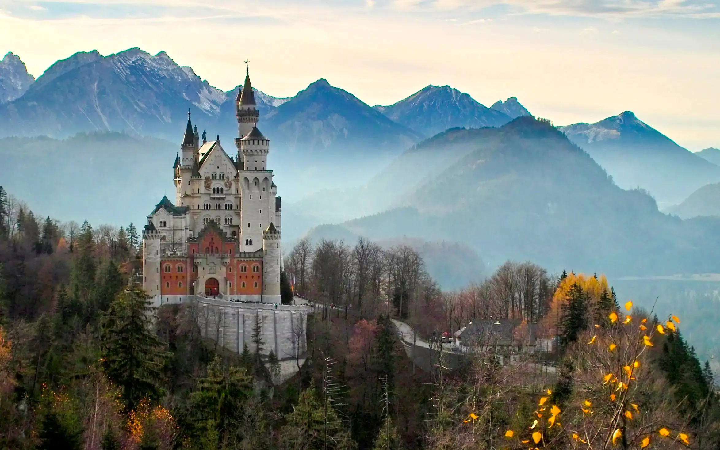 Neuschwanstein Castle with Bavarian Alps backdrop in Germany.