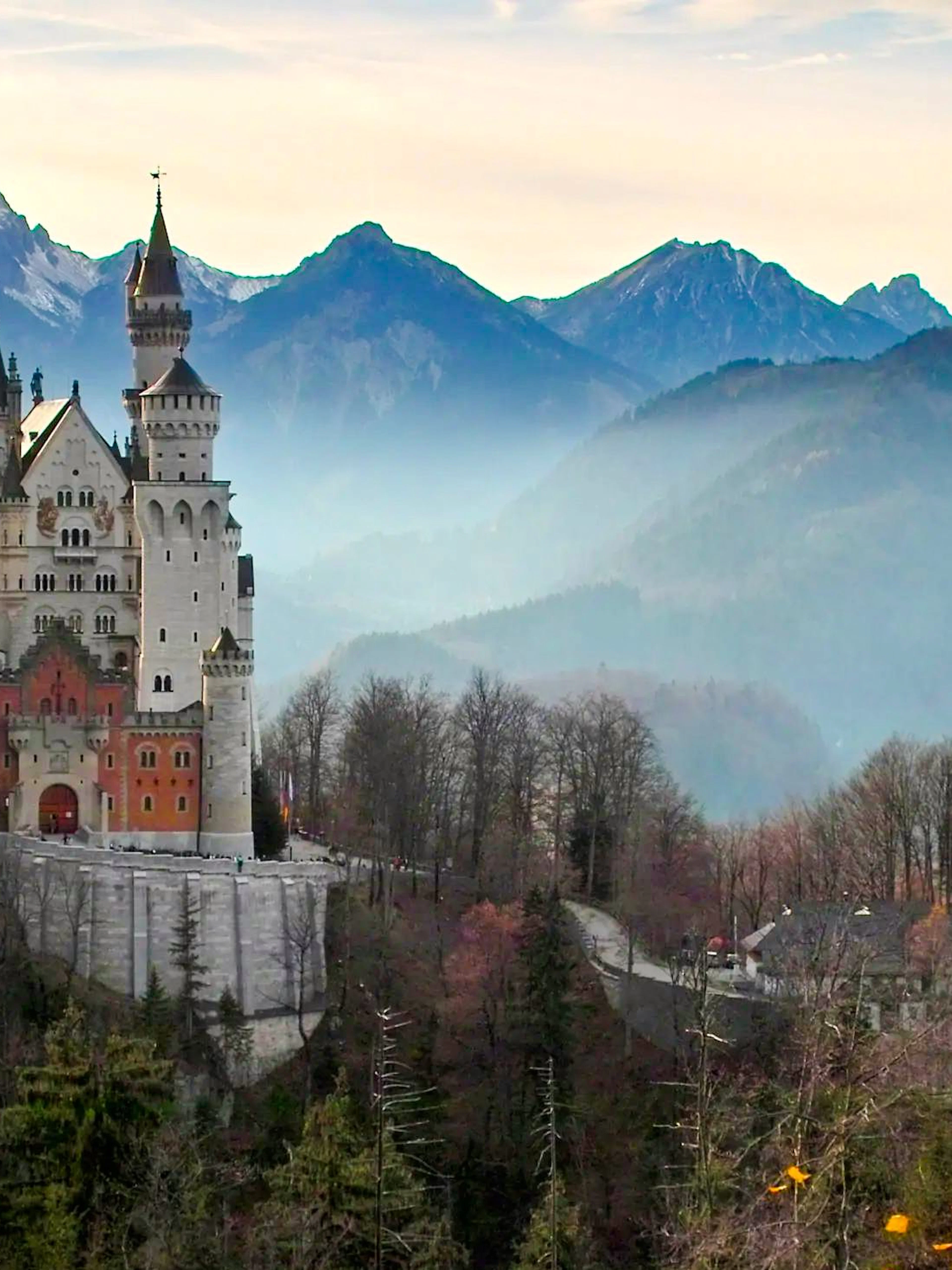 Neuschwanstein Castle with Bavarian Alps backdrop in Germany.