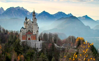 Neuschwanstein Castle with Bavarian Alps backdrop in Germany.