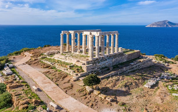 Temple of Poseidon at Cape Sounion overlooking the Aegean Sea.