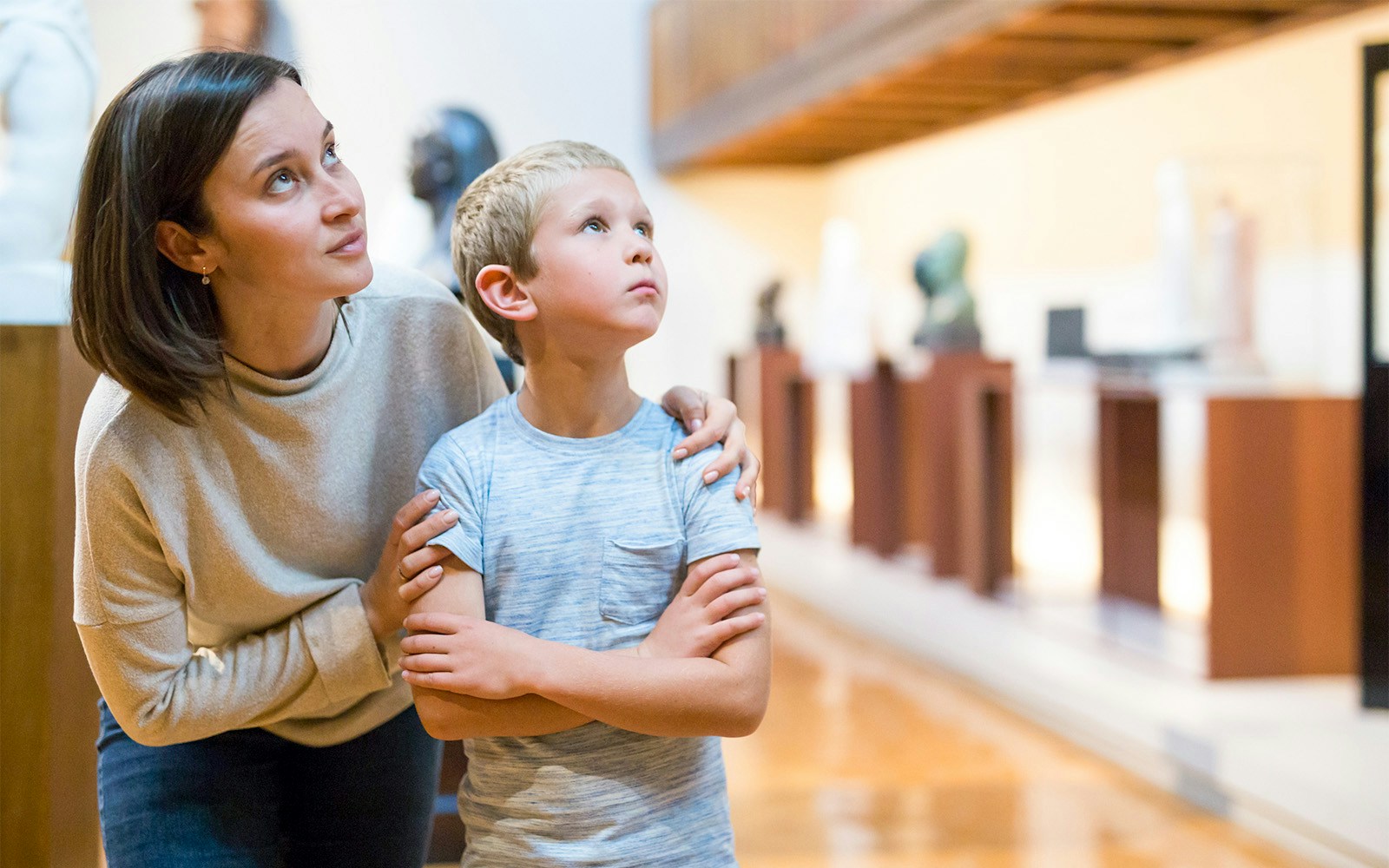 Visitors exploring art in a Montmartre museum gallery.