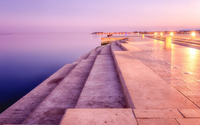 Sea organ steps at sunset in Zadar, Croatia, overlooking the Adriatic Sea.