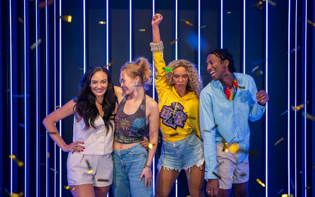 Beyonce wax figure with visitors at Madame Tussauds London.