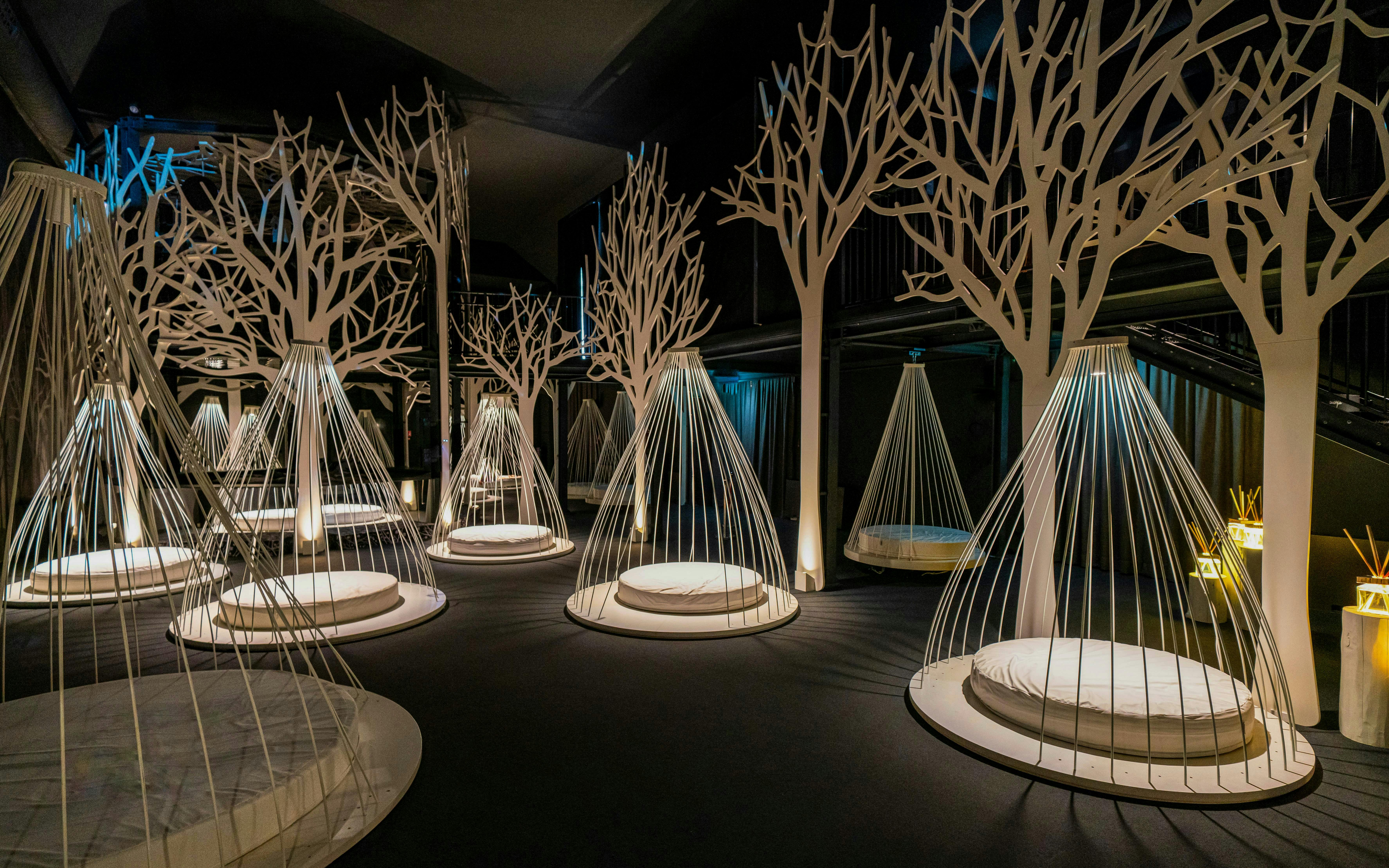 Relaxation area with hanging loungers inside QC Terme spa in Milan.