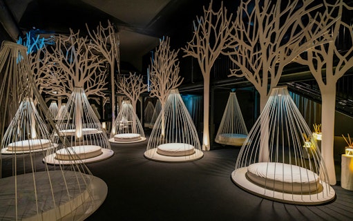 Relaxation area with hanging loungers inside QC Terme spa in Milan.