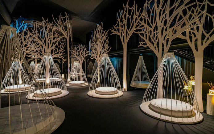 Relaxation area with hanging loungers inside QC Terme spa in Milan.