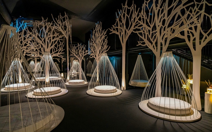 Relaxation area with hanging loungers inside QC Terme spa in Milan.