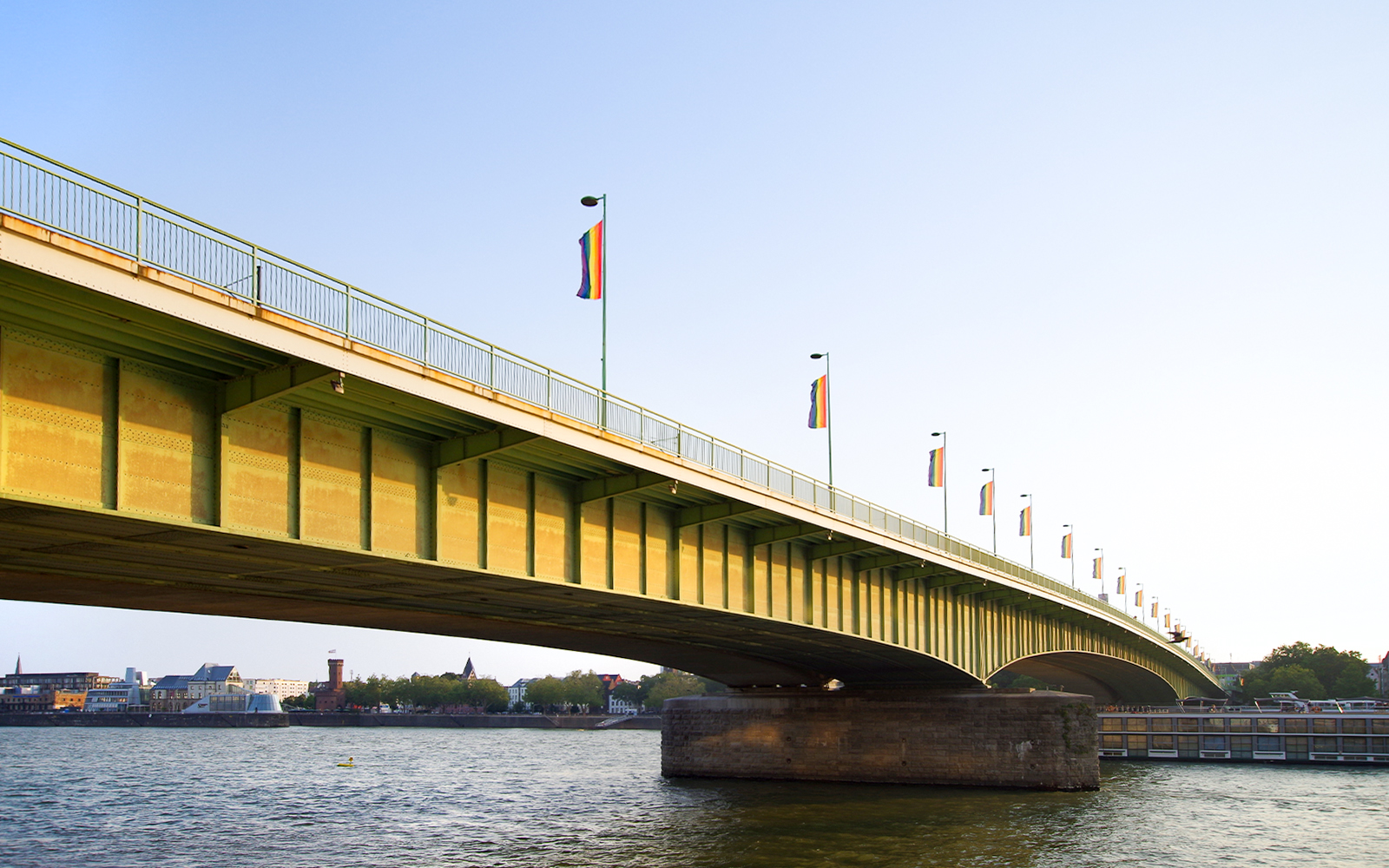 Deutz Bridge spanning the Rhine River in Cologne with cityscape in the background.