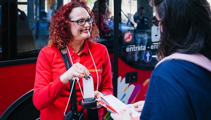 Tourists enjoying the City Sightseeing 24/48/72-Hr Hop-On Hop-Off Tour of Florence, Italy, with a view of the iconic Florence Cathedral from the open-top bus