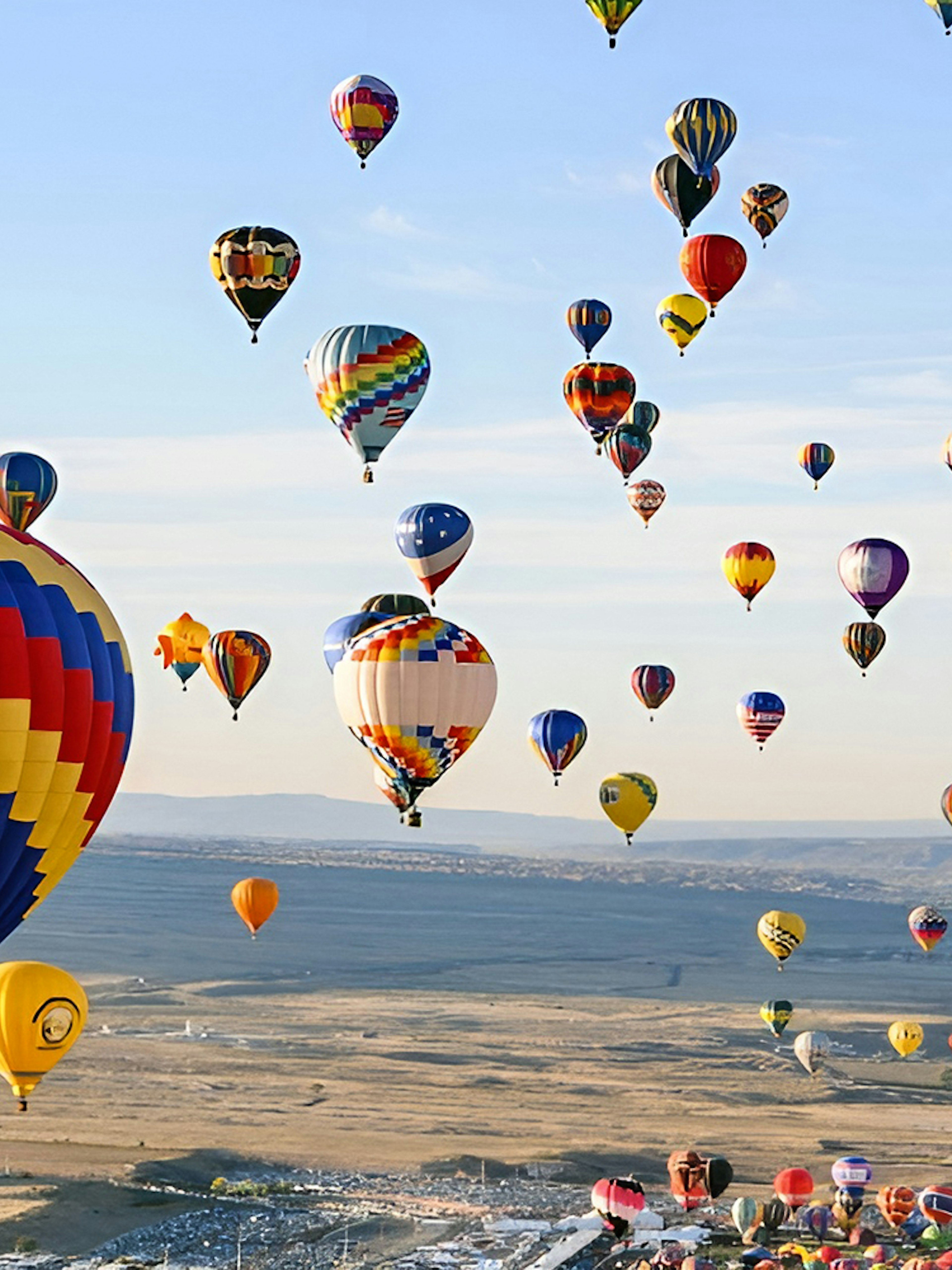 Hot air balloons over Luxor landscape during a luxury balloon ride experience.