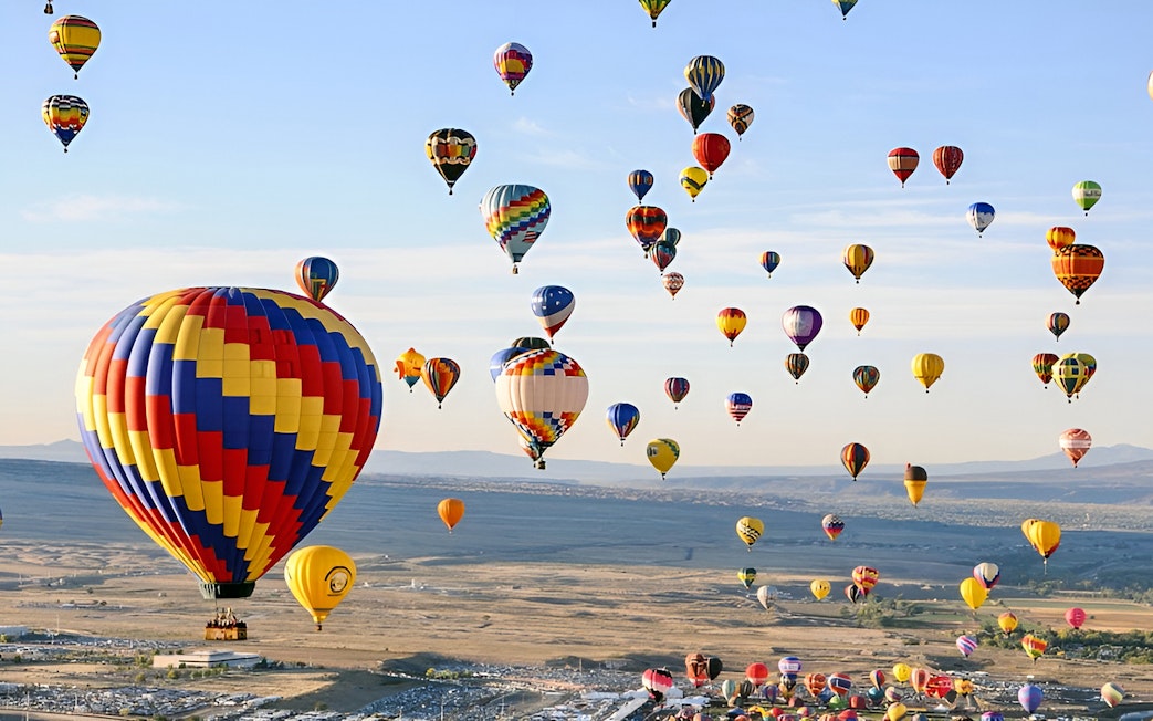 Hot air balloons over Luxor landscape during a luxury balloon ride experience.