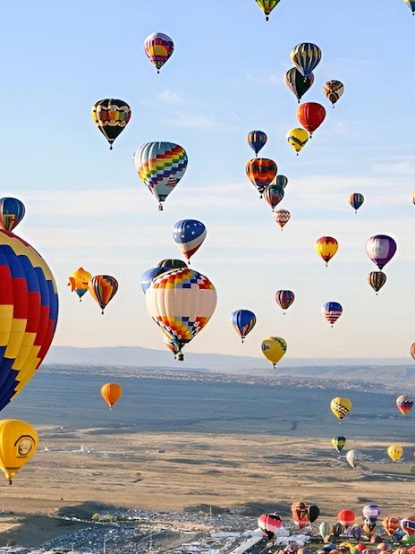 Hot air balloons over Luxor landscape during a luxury balloon ride experience.