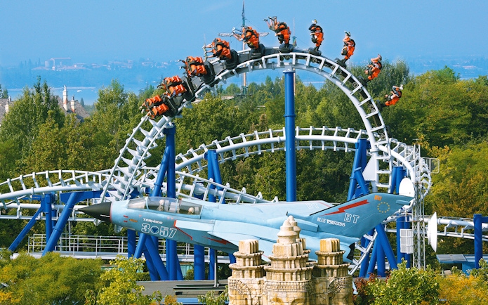 Roller coaster loop on Blue Tornado Ride at Gardaland Park, Italy, with jet-themed design.