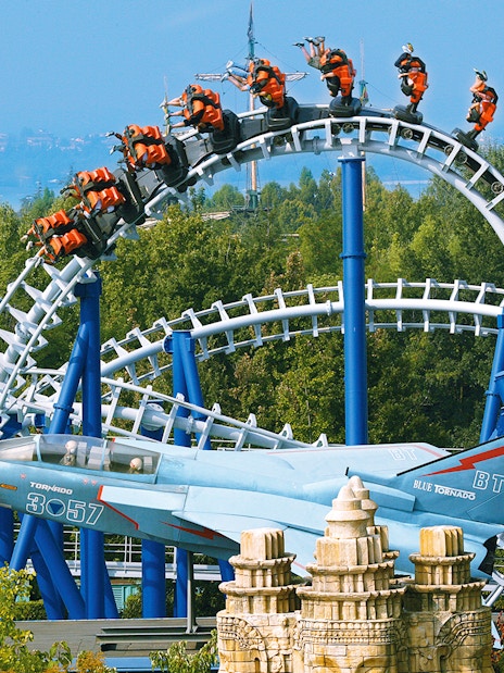 Roller coaster loop on Blue Tornado Ride at Gardaland Park, Italy, with jet-themed design.