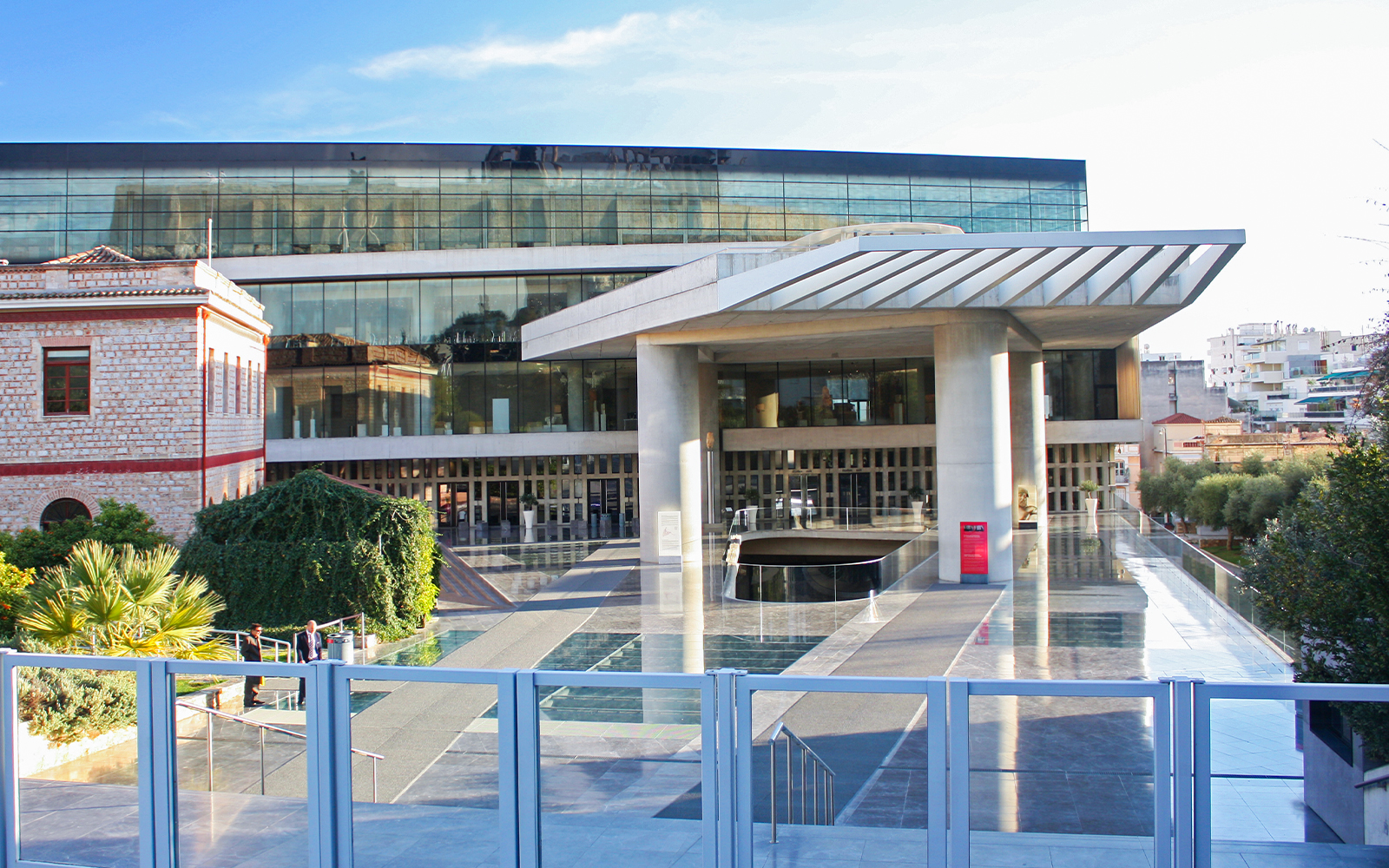 Acropolis Museum entrance in Athens, Greece with modern architecture and glass facade.