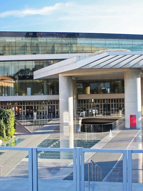 Acropolis Museum entrance in Athens, Greece with modern architecture and glass facade.