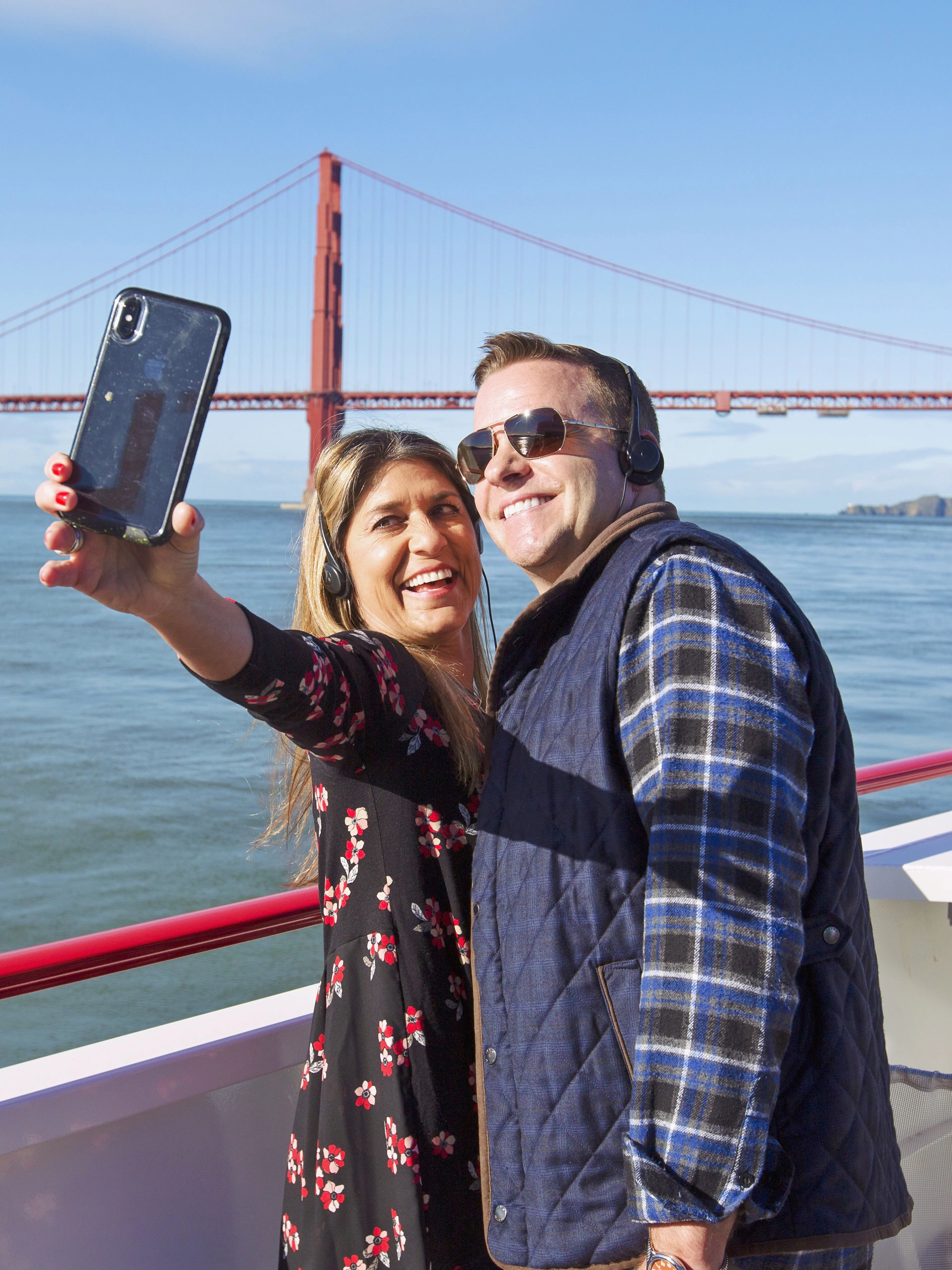 Couple taking a selfie on a Golden Gate Bridge cruise in San Francisco.