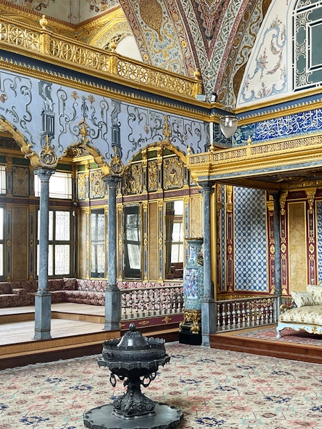 Topkapi Palace Harem interior with ornate decor and seating area, Istanbul.